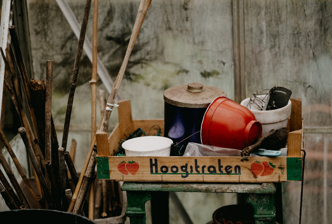a wooden crate filled with pots and pans